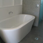 Bath tub clean white tiling design